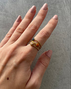Anillo marrón, naranja y dorado de acero inoxidable y arcilla polimérica